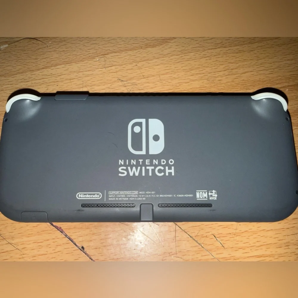 Nintendo Switch Lite Black Handheld Console with Black Charger and Case